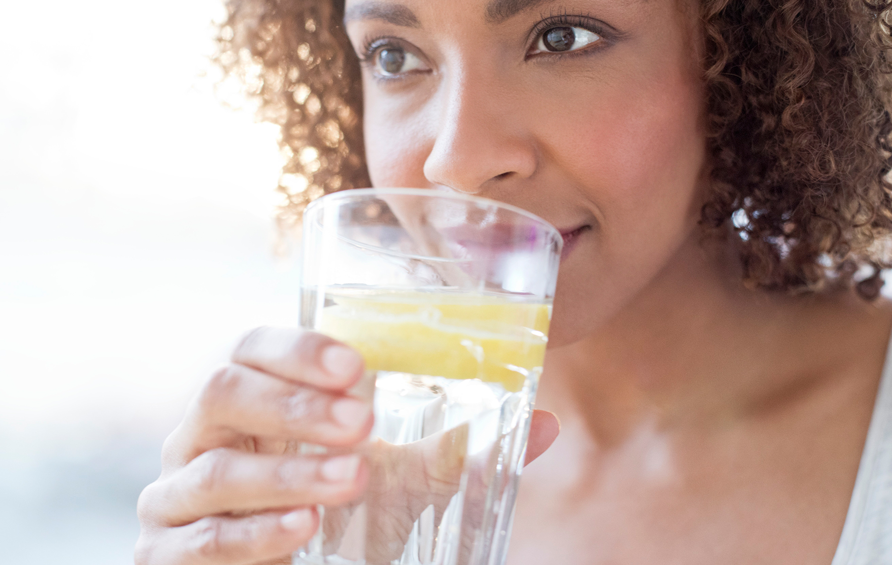 AltaMed woman drinking water