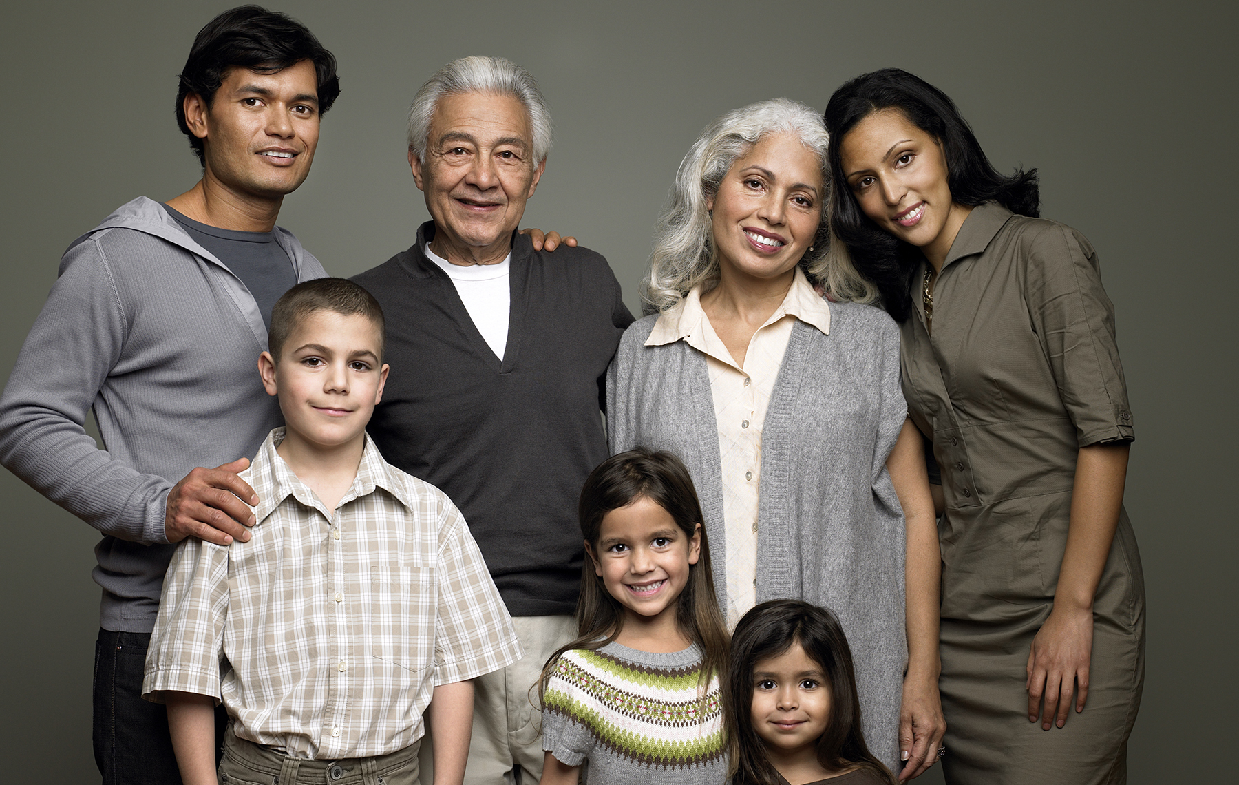 AltaMed Latino family in group shot smiling