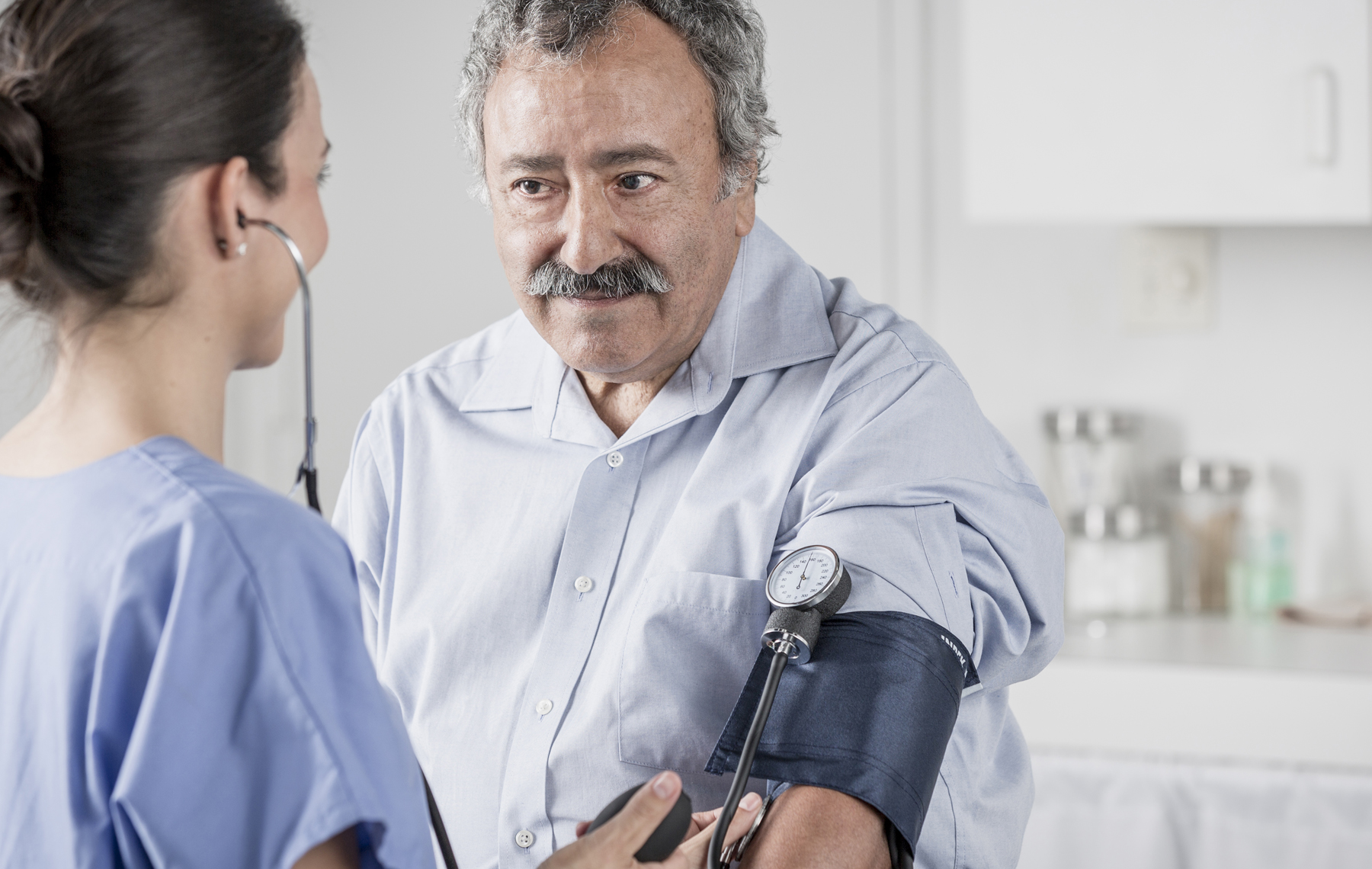 AltaMed man getting blood pressure checked