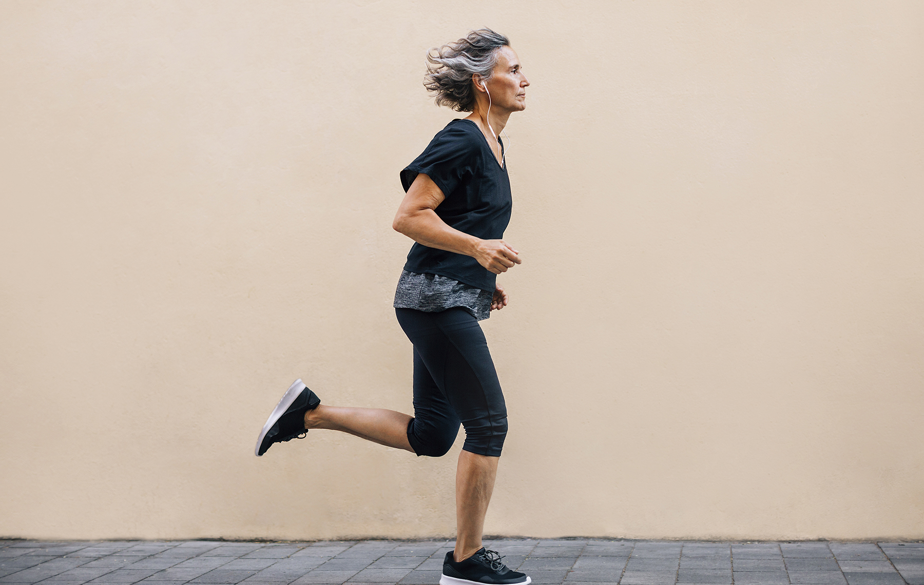 AltaMed woman running on the street